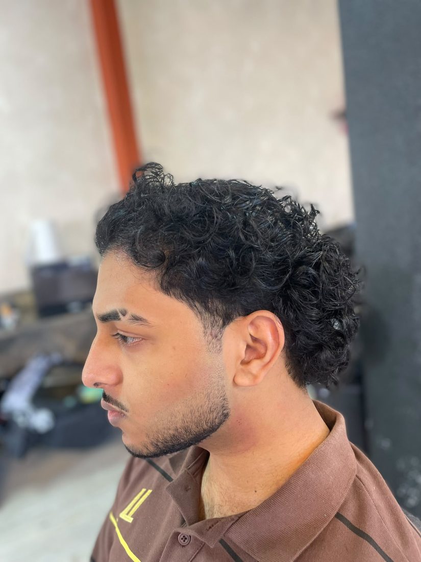 Curly fade, side profile